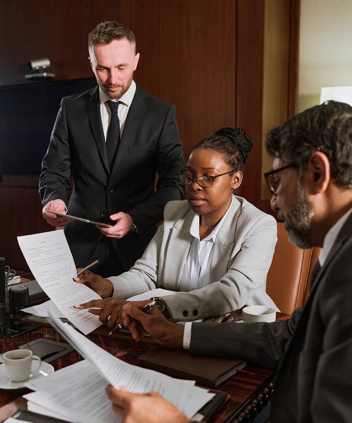 meeting pointing at document