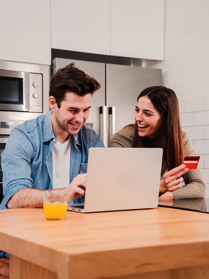 Couple on laptop in kitchen