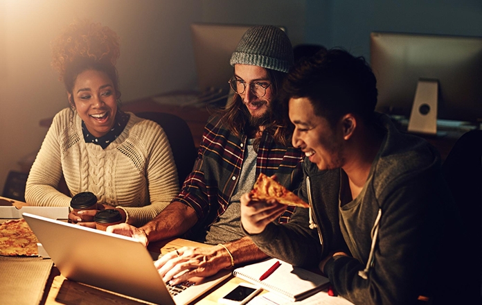 Family looking at tablet at night