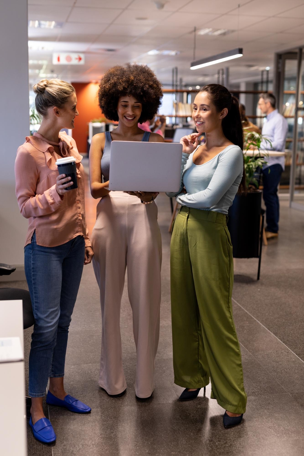 Two women shopping and discussing deals in store