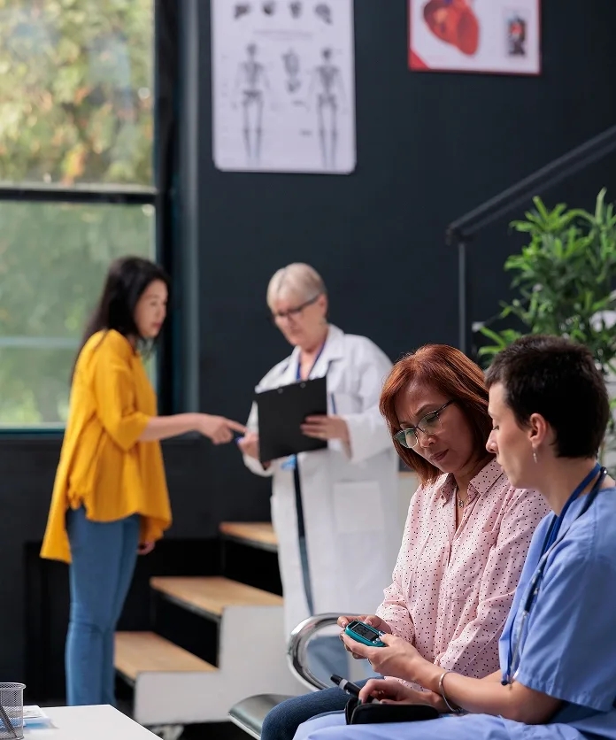 Nurse checking patient metrics