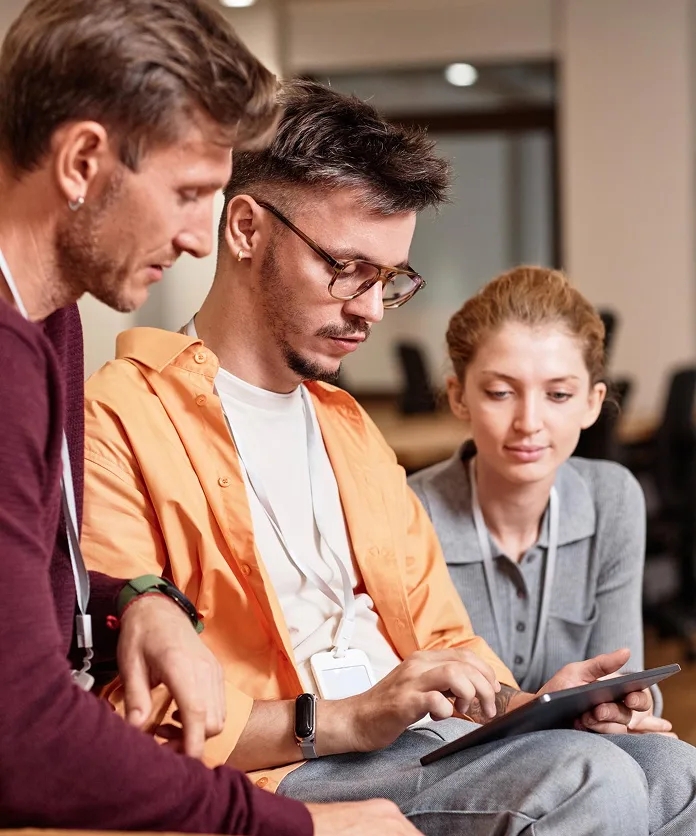 team collaborating on a laptop