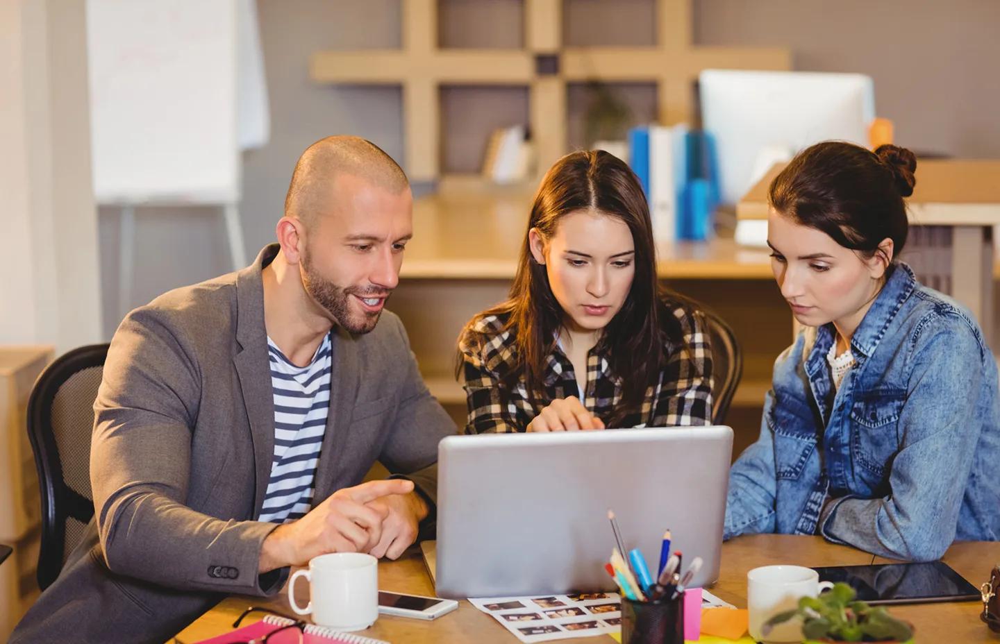 SEO team reviewing link building work together