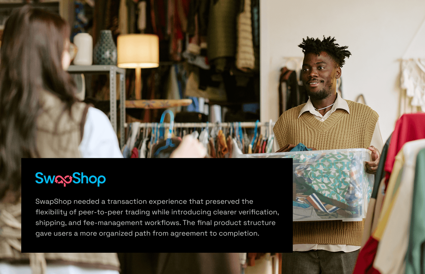 Two people exchanging items inside a SwapShop clothing store