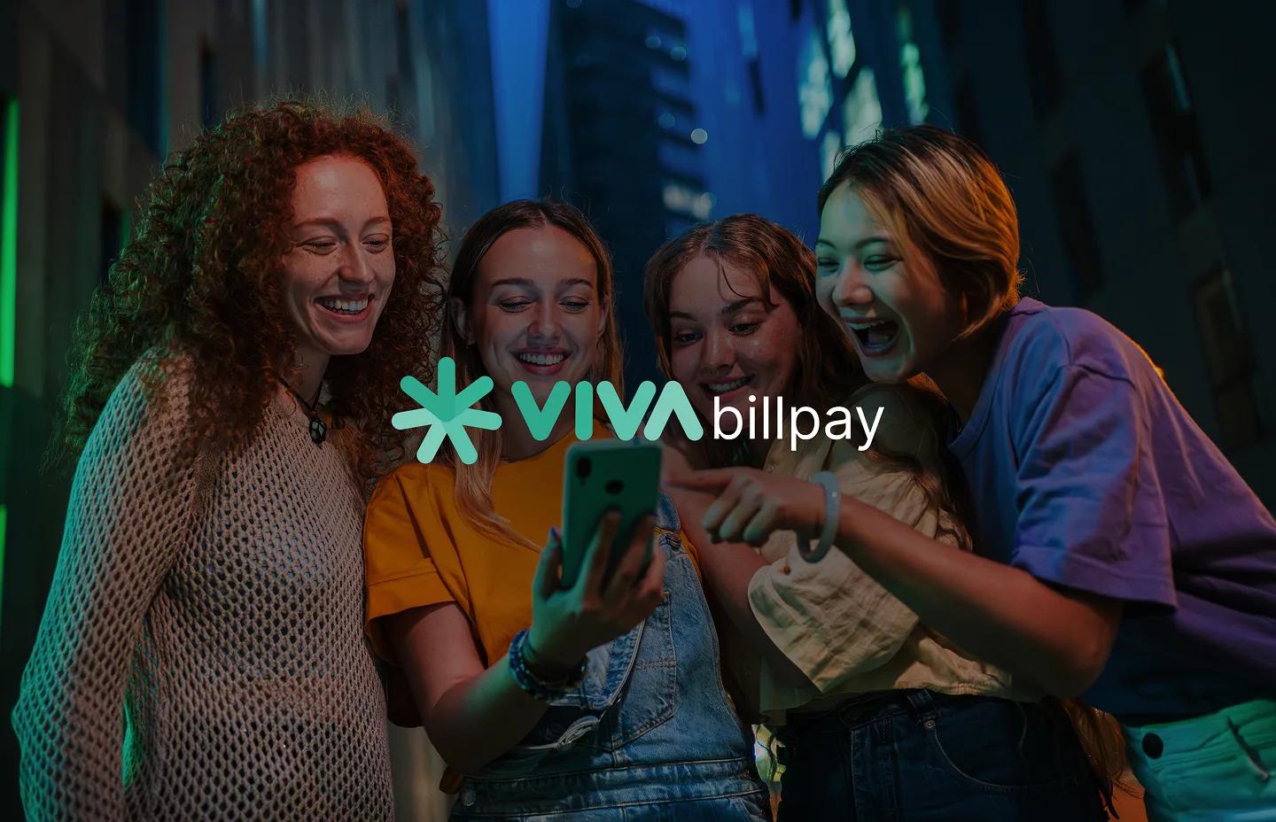 Four smiling girls looking at a mobile screen showing the Viva Bill Pay app success state