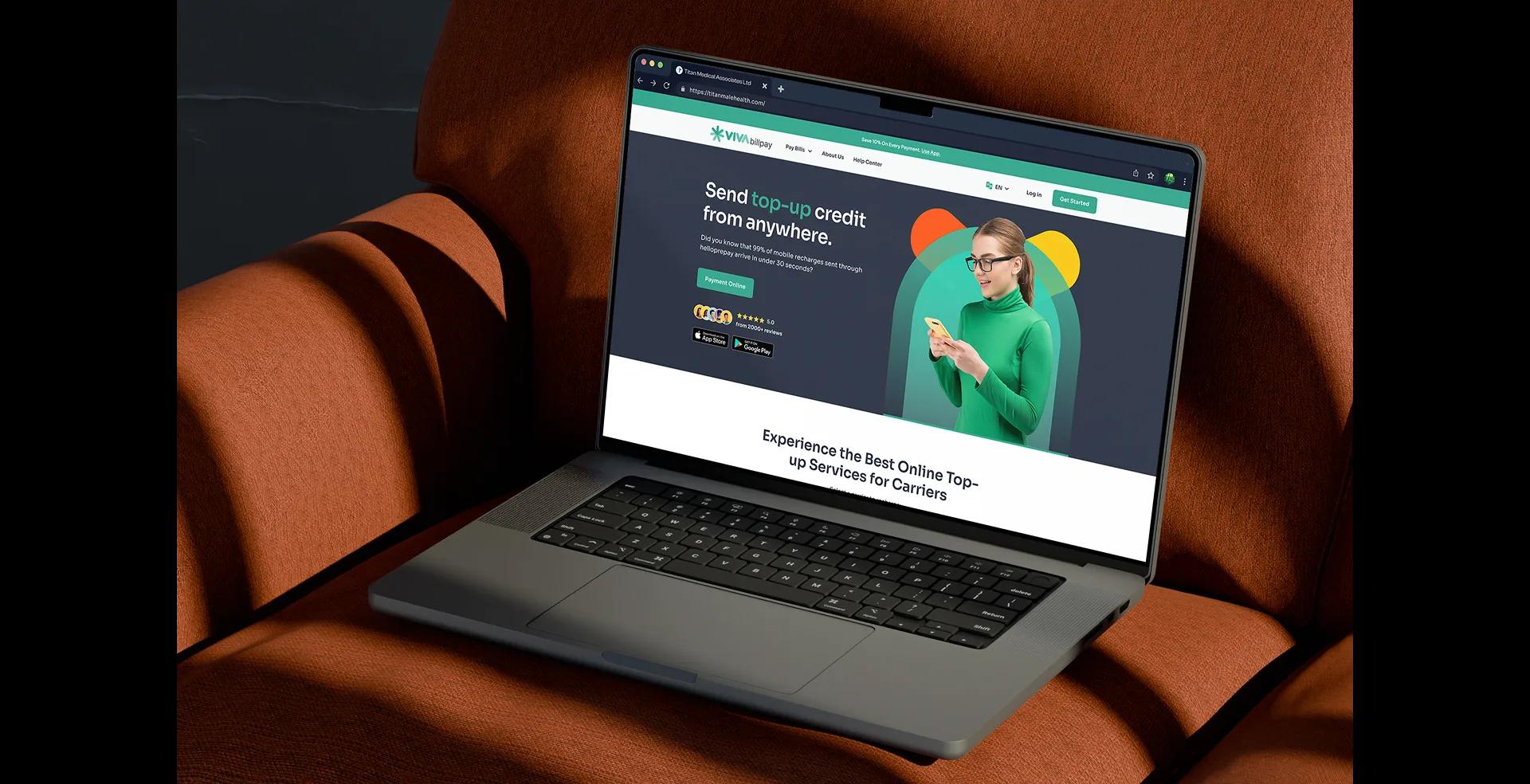 Viva Bill Pay platform open on a laptop resting on a brown leather sofa