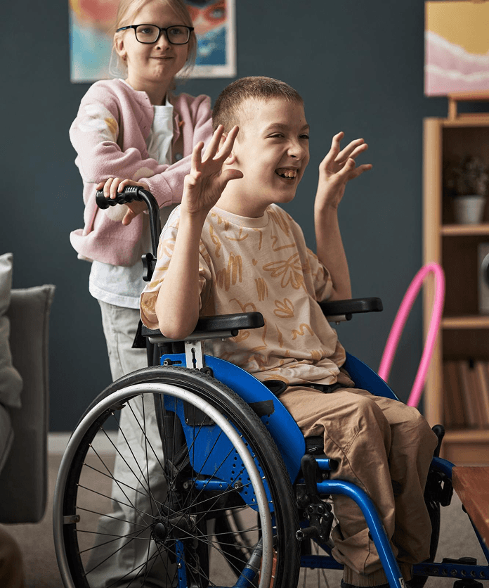 Siblings playing together, one in a wheelchair