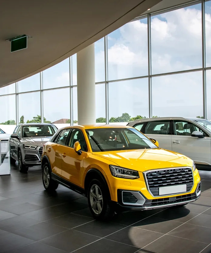 Yellow SUV displayed in a dealership showroom
