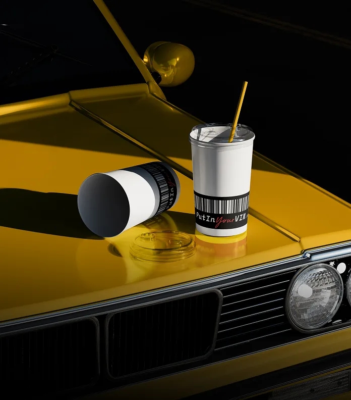Branded cups on a yellow car hood