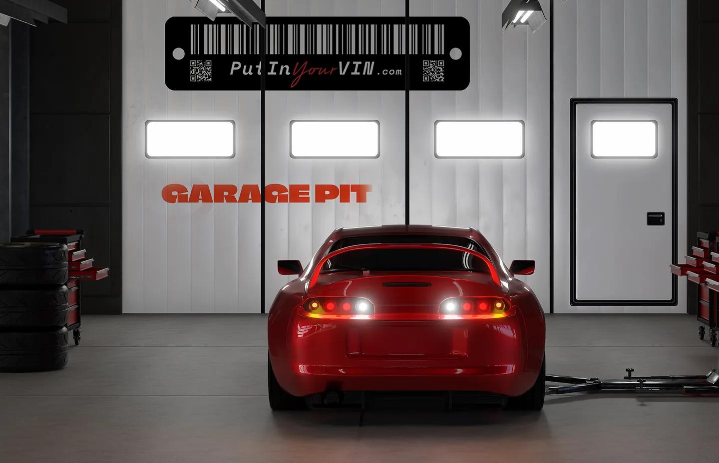 Red car in a garage bay with Put In Your VIN branding
