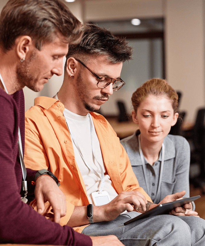 team collaborating on a laptop