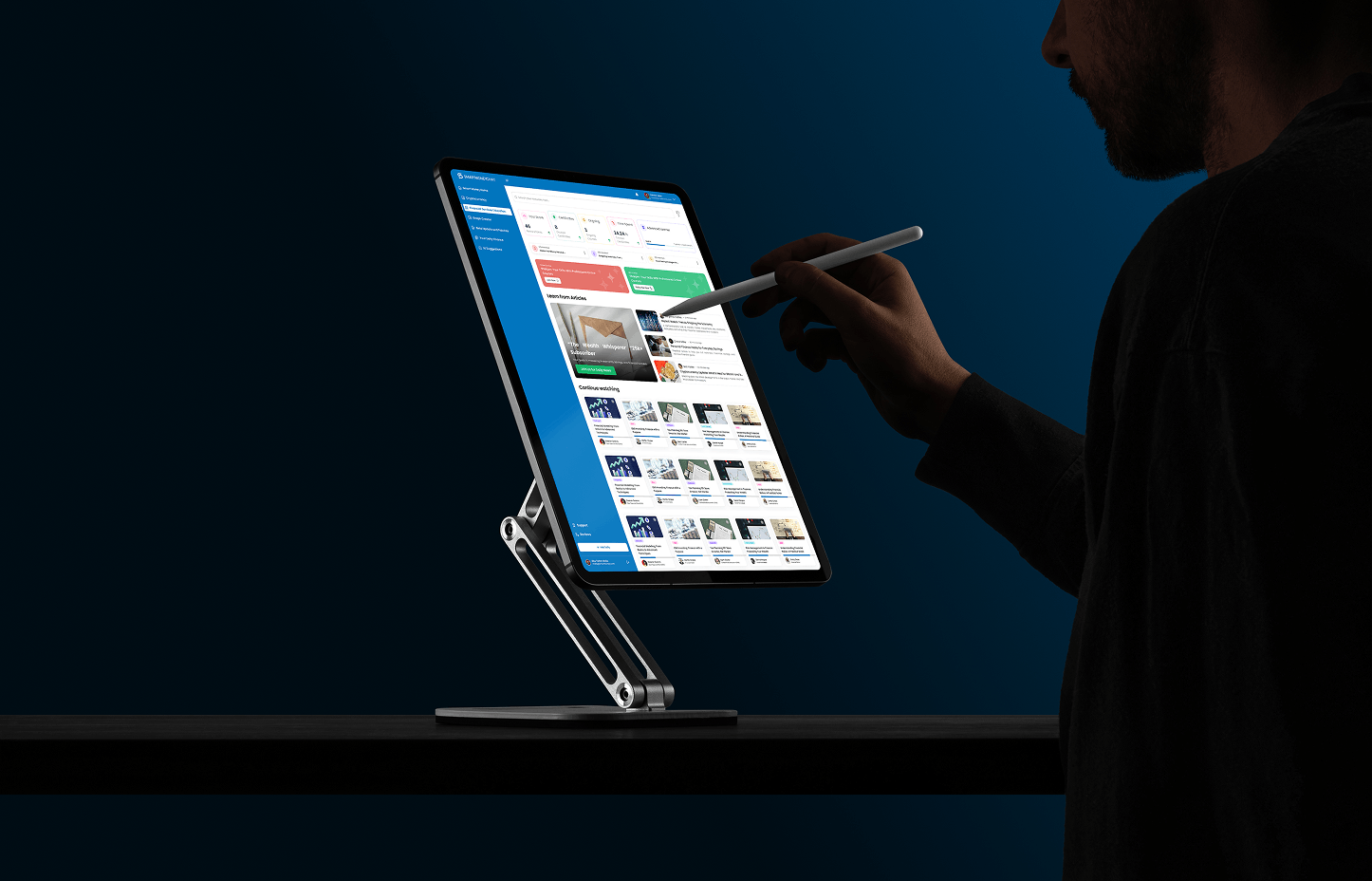 Monitor on an adjustable stand showing the Teacher AI Studio content tools