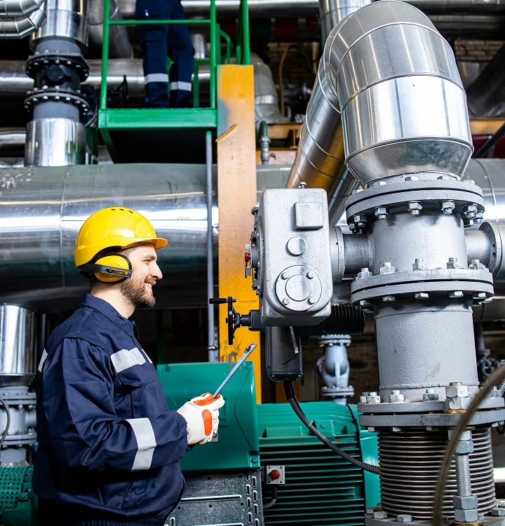 Gas Engineer working on industrial piping equipment