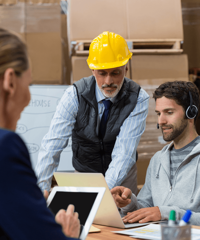 Safety supervisors reviewing product specifications