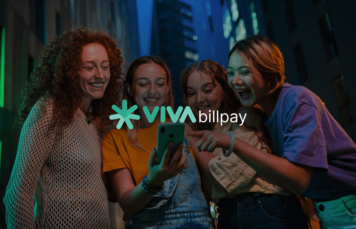 Four smiling girls looking at a mobile screen showing the Viva Bill Pay app success state