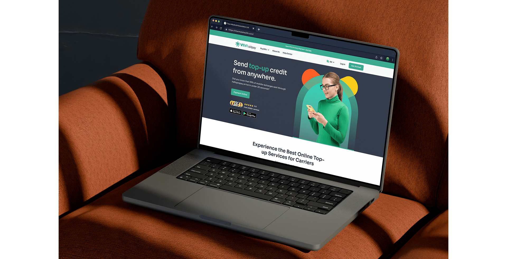 Viva Bill Pay platform open on a laptop resting on a brown leather sofa